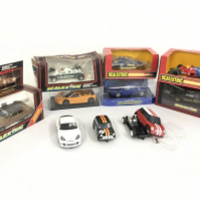 A collection of 10 Scalextric cars, boxed and loose. Most in running order . No reserve