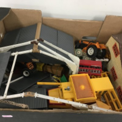 Britains combine harvester tractors plus other farm machinery. Includes 2 Atcost barns plus farm buildings