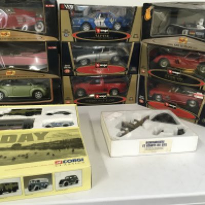 A collection containing burago and Maisto 1..18 scale model cars. Also Corgi D Day set . Includes Model Avro Lancaster. No reserve.