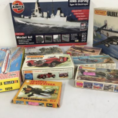 An assorted collection of model kits by Airfix..Matchbox..Faller etc. featuring aircraft, a warship and a car. No reserve.