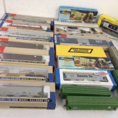 A collection of boxed and loose HO gauge model railway cars and wagons in both kit and ready to run form. Manufacturers include Walthers..Athearn etc. no reserve