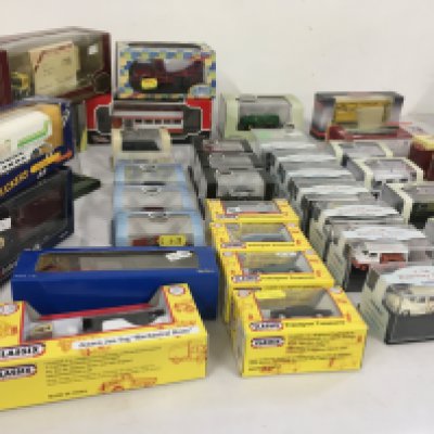 A collection of diecast model vehicles by Oxford..Corgi and others. Many are mounted in plastic display boxes. No reserve