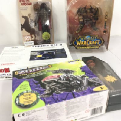 A collection of 5 boxed toys featuring Zoids Hel Digunner&hellip;Curtis R3C.0 model aircraft kit&hellip;carded Headless Horseman 8 inch action figure&hellip;World of Warcraft Thargas Anvilmar&hellip;Pumpkin Jack Porcelain doll from Nightmare before Christmas. No reserve