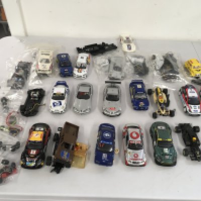 A collection of Scalextric..Hornby slot racing cars with spares and accessories. Spares or repairs. No reserve.