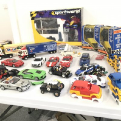 A collection of Scalextric ..Hornby cars and lorries. Includes accessories and boxed Sportsworld multi-lane extension kit. No reserve