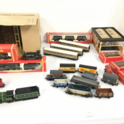 A Collection of 00gauge model railway including locomotives..coaches and wagons by Hornby etc. also includes some buildings.