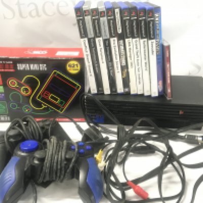 A Sony PlayStation 2. With Controllers. Games And A Boxed Super HD Mini Entertainment System.