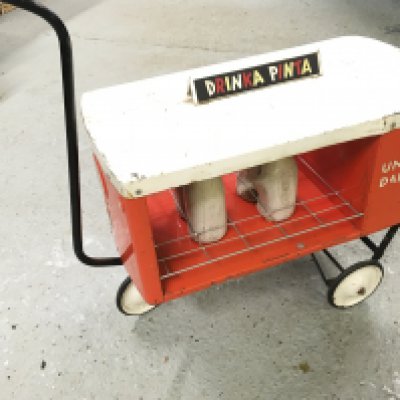 A 1960s Tri-Ang Pull Along Toy Milk Float.