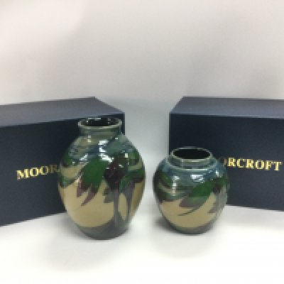 Two boxed Mooorcroft Moon Valley vases designed by Nicola Slaney,, approx heights 13.5cm and 9.5cm. Shipping category D.