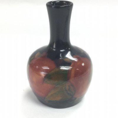 A small Moorcroft Pomegranate bud vase, circa 1916-18, not signed, approx height 9.5cm. Shipping category D.