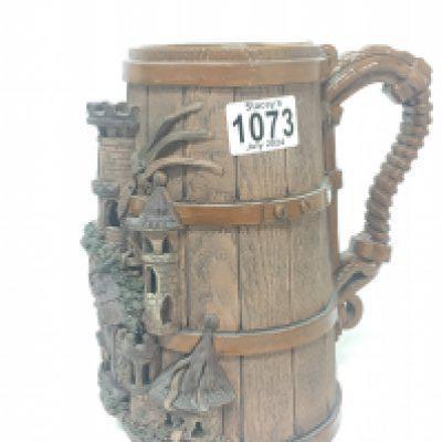 An unusual German pottery tankard with raised Castle tower decoration marks to the base Height 22cm. NO RESERVE