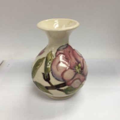 A Moorcroft hibiscus vase decorated with flowers and foliage. NO RESERVE