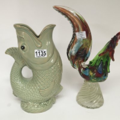 A mid 20th Century glass Murano Cockerel multi coloured glass no obvious damage and a large ceramic jug in the form of a fish. Hight 36cm (2)