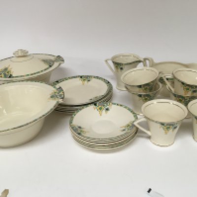 An Art Deco Design Crawford Burslem tea and part dinner set with a green patterned floral boarder.
