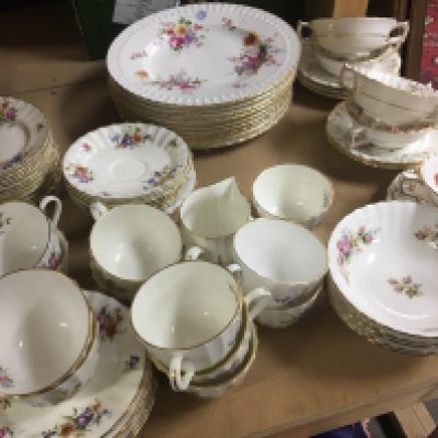 A set of Royal Crown Derby Porcelain plates decorated with flowers and foliage with matching soup bowls with dishes. A collection of Royal Worcester Roanoke pattern dinner ware and Royal Albert porcelain Moss Rose pattern bowls all with a conforming pattern.