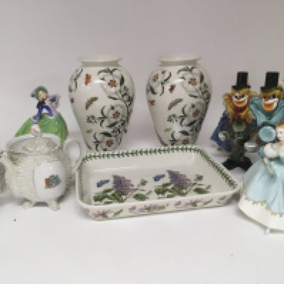 A pair of Portmeirion porcelain vases The Botanical Garden pattern a conforming dish Murano glass clowns a decorative tea set.