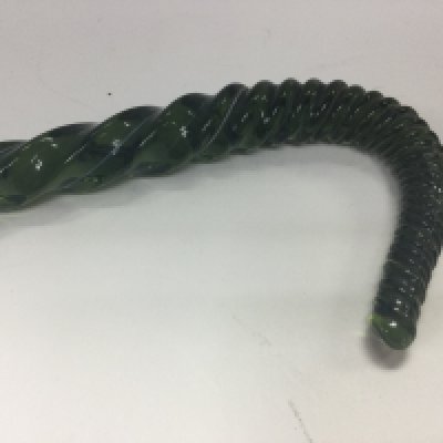 A Victorian green glass walking stick of twisted form .