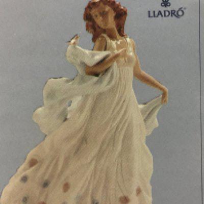 A boxed Lladro figure summer serenade . No damage or restoration.