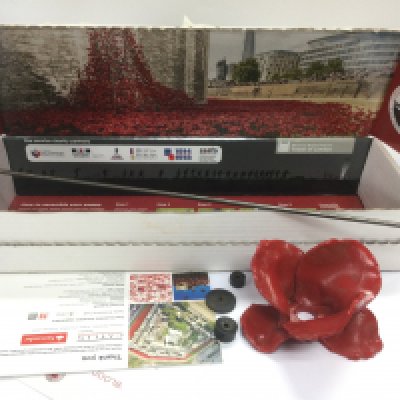 A boxed Paul Cummins Tower of London ceramic poppy of remembrance. Shipping category D.