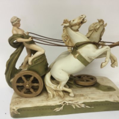 A large late 19th century Royal Dux Porcelain centre peice in the form of a horse drawn chariot no obvious damage or restoration length 45cm Height 35cm