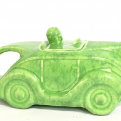 A vintage porcelain Sadlers green racing car tea pot