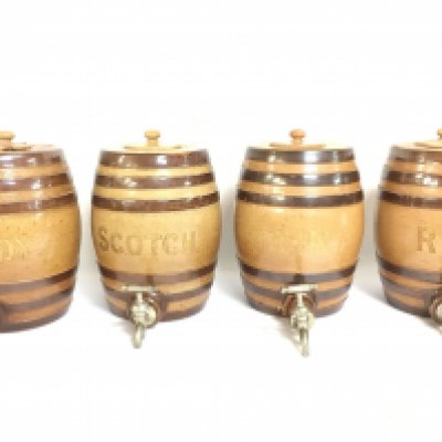 Royal Doulton Lambeth Spirit barrels, Brandy, Scotch, Gin and Rum. 26cm tall 18cm wide. Some damage. This lot cannot be posted