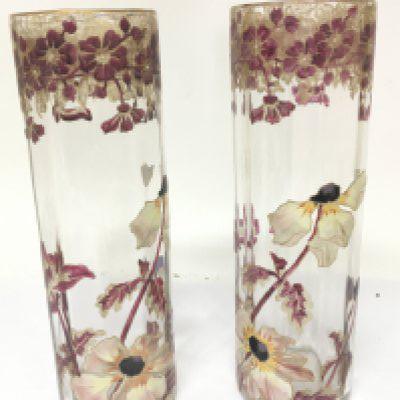 A pair of quality Art Nouveau glass vases enamel decorated with flowers and foliage with applied gilt most probably from the glassworks of Ludwig Moser. no obvious damage or restoration. Height 28cm