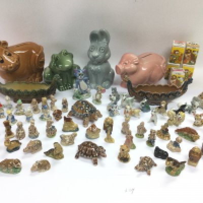 A large collection of Wade items comprising whimsies, money boxes etc. Shipping category D.