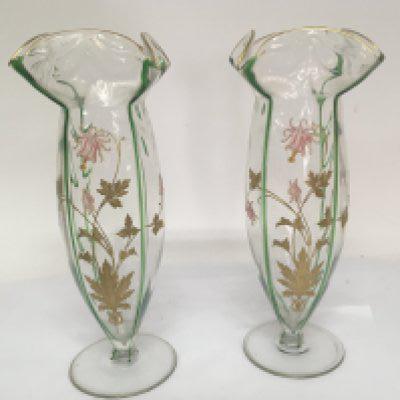 A Pair of quality Art Nouveau glass vases with shaped rims and vertical green drawn glass lines subdividing panels of applied gilt and pink enamel in the form of flowers and foliage. Height 32cm no obvious damage.