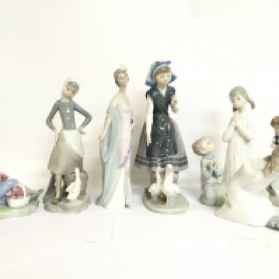 A collection of Lladro figures. 14 to 27cm tall. This lot cannot be posted