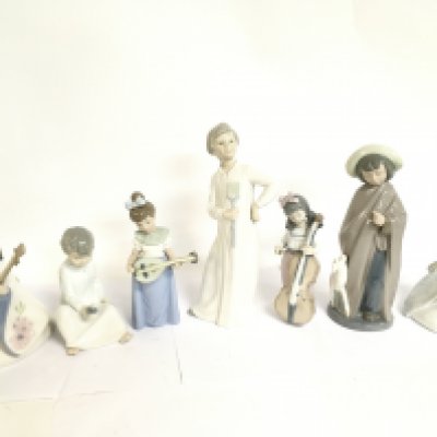 A collection of porcelain Nao figures. This lot cannot be posted