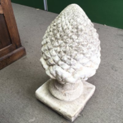 A concrete garden acorn ornament. 60x32cm Approx.