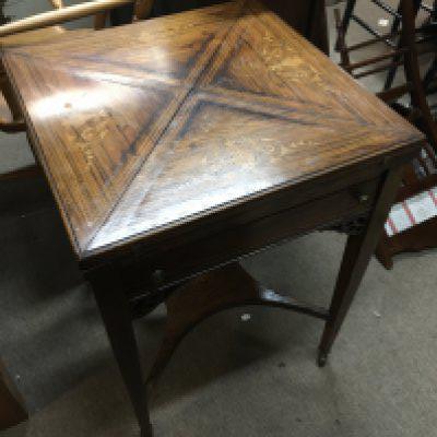 An Edwardian rosewood envelope card table with inlaid design dimensions 53x53x70cm.