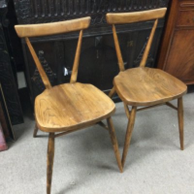 A pair of Ercole stacking chairs , 76cm tall.