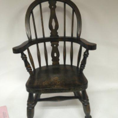 A Child&rsquo;s Windsor chair with a shaped back height 29cm