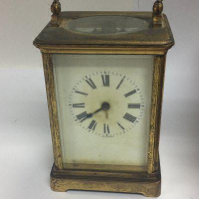 A brass case carriage clock in fitted leather case.