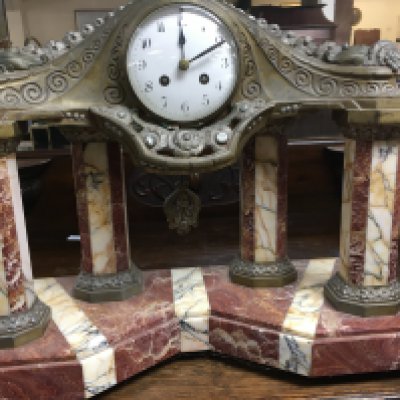 A marble mantle clock the circular enamel dial with Arabic numerals drop Pendulum with art Nouveau influence. 40 cm 40 cm .