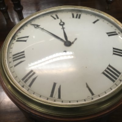 A mahogany drop dial wall clock the painted dial with Roman numerals with pendulum. 30 cm