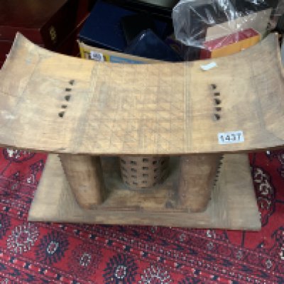 An African 20thC carved Ashanti tribal wooden stool. 52cm x 34cm x 26cm. (D)