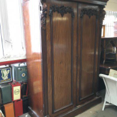 A large Victorian Mahogany wardrobe with carved wooden floral design. Dimensions 68x138x208cm