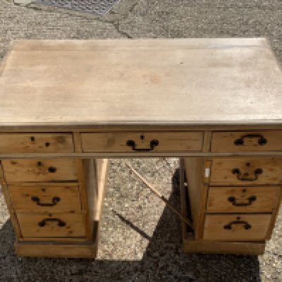 A vintage pine pedastal desk.