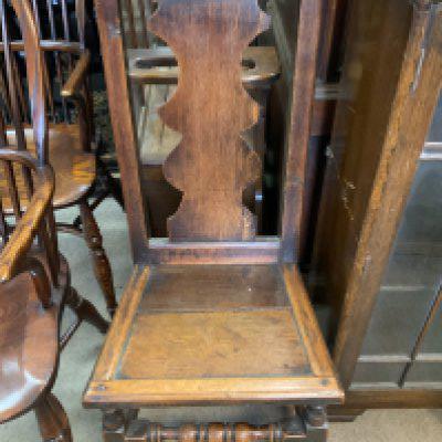 A Late 18thC oak hall chair.