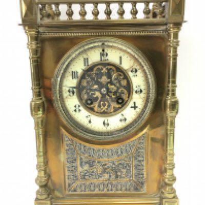 An Ornate brass mid 19th century French mantle clock with pendulum. Dimensions 12x18x31. This lot cannot be posted