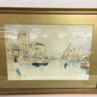 A framed watercolour painting of a Venetian scene signed M. Gray. This lot cannot be posted