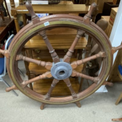 A large original ships wheel with a brass and cast iron centre shaft. 1370cm diameter. 