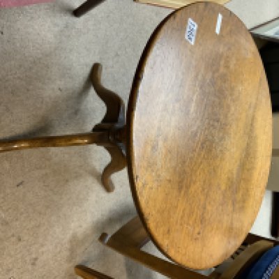 A small circular oak teatable.