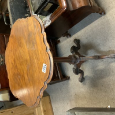 A small Victorian mahogany wine table with tripod foot.