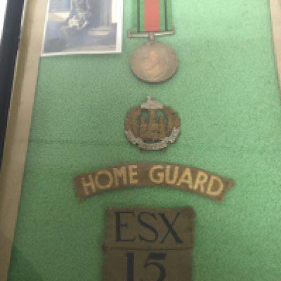 A Second World War medal Essex Home Guard. With photo cloth badges.
