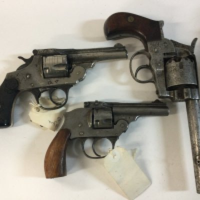 Two replica handguns and one obsolete calibre pistol.