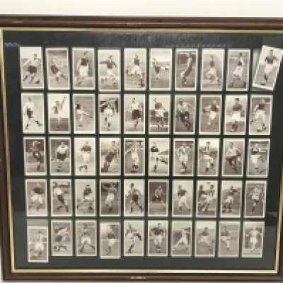 A framed collection of vintage Churchmans Cigarettes football cards, dimensions 50x46cm